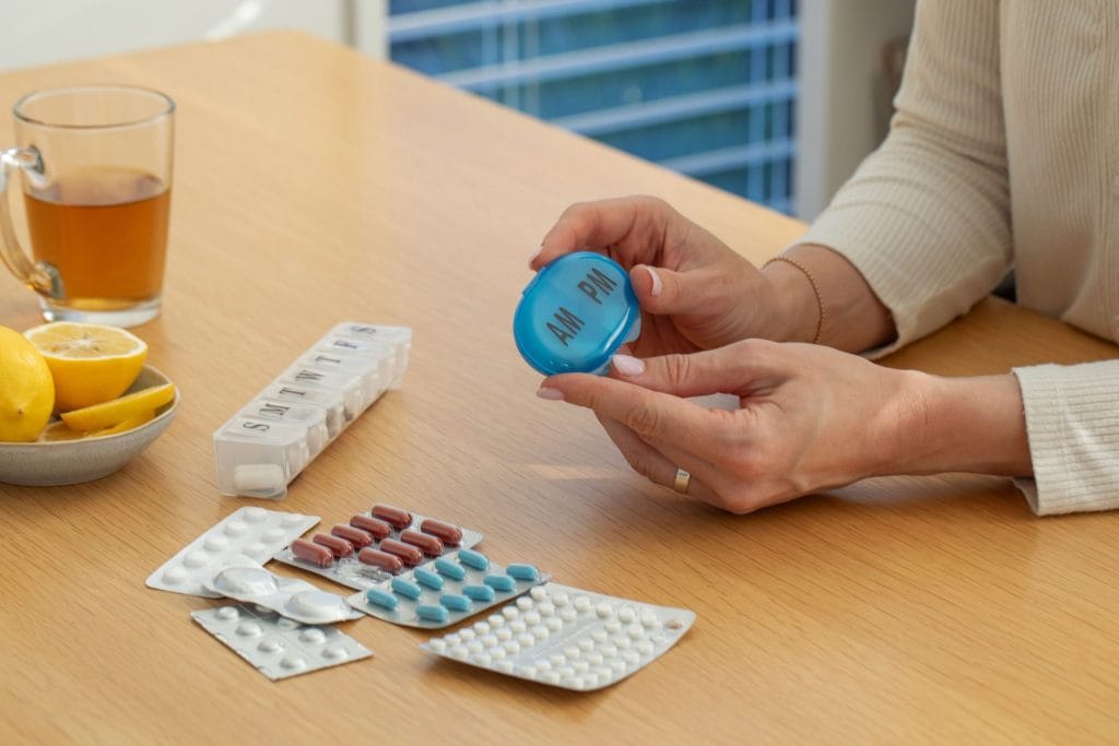 caucasian-woman-organizes-weekly-medication-