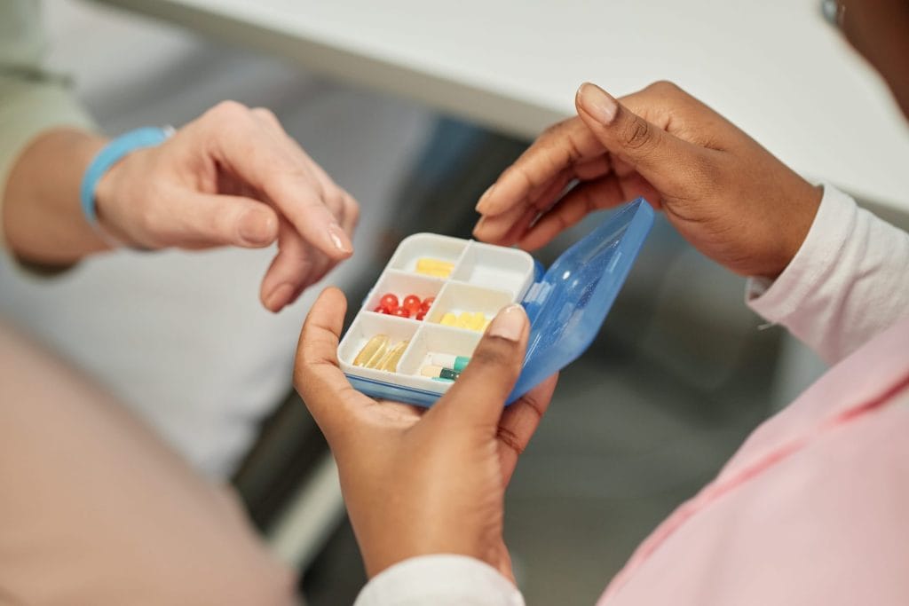 sharing-medication-from-pill-organizer