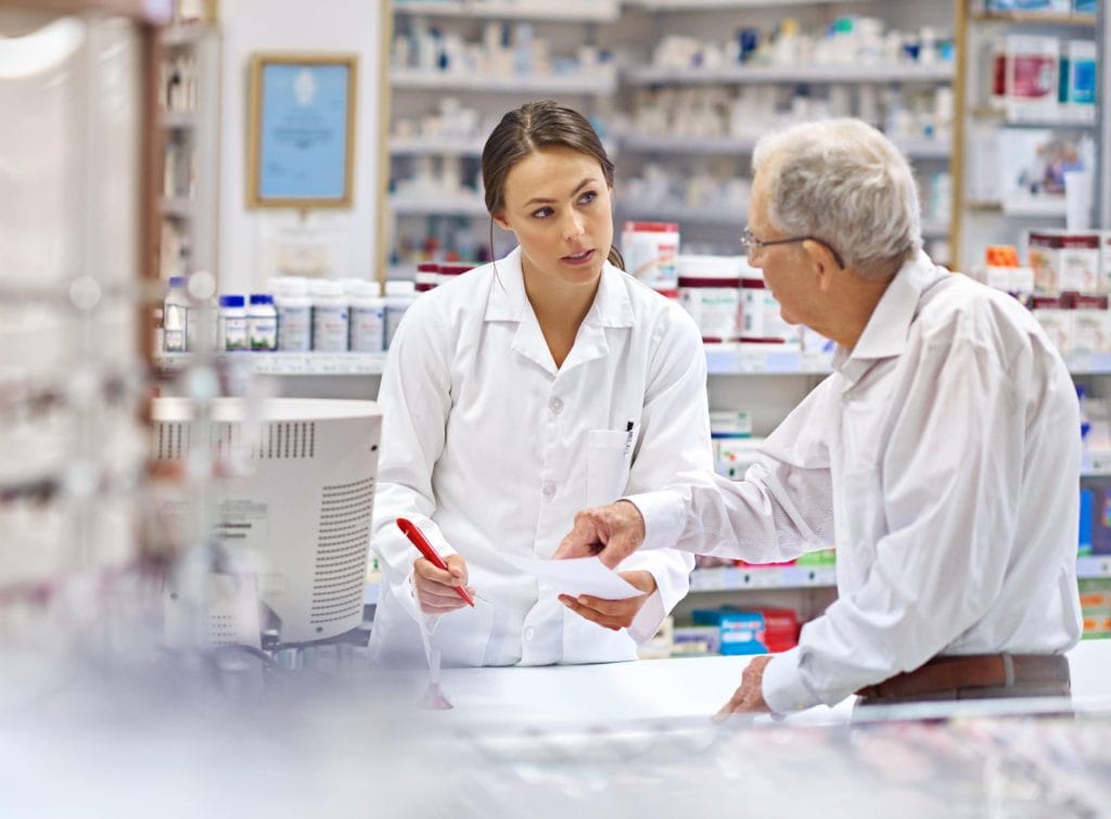 shot-of-a-young-pharmacist-helping