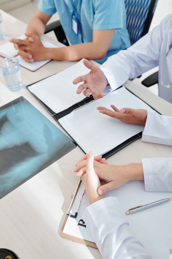 medical-specialists-discussing-disease